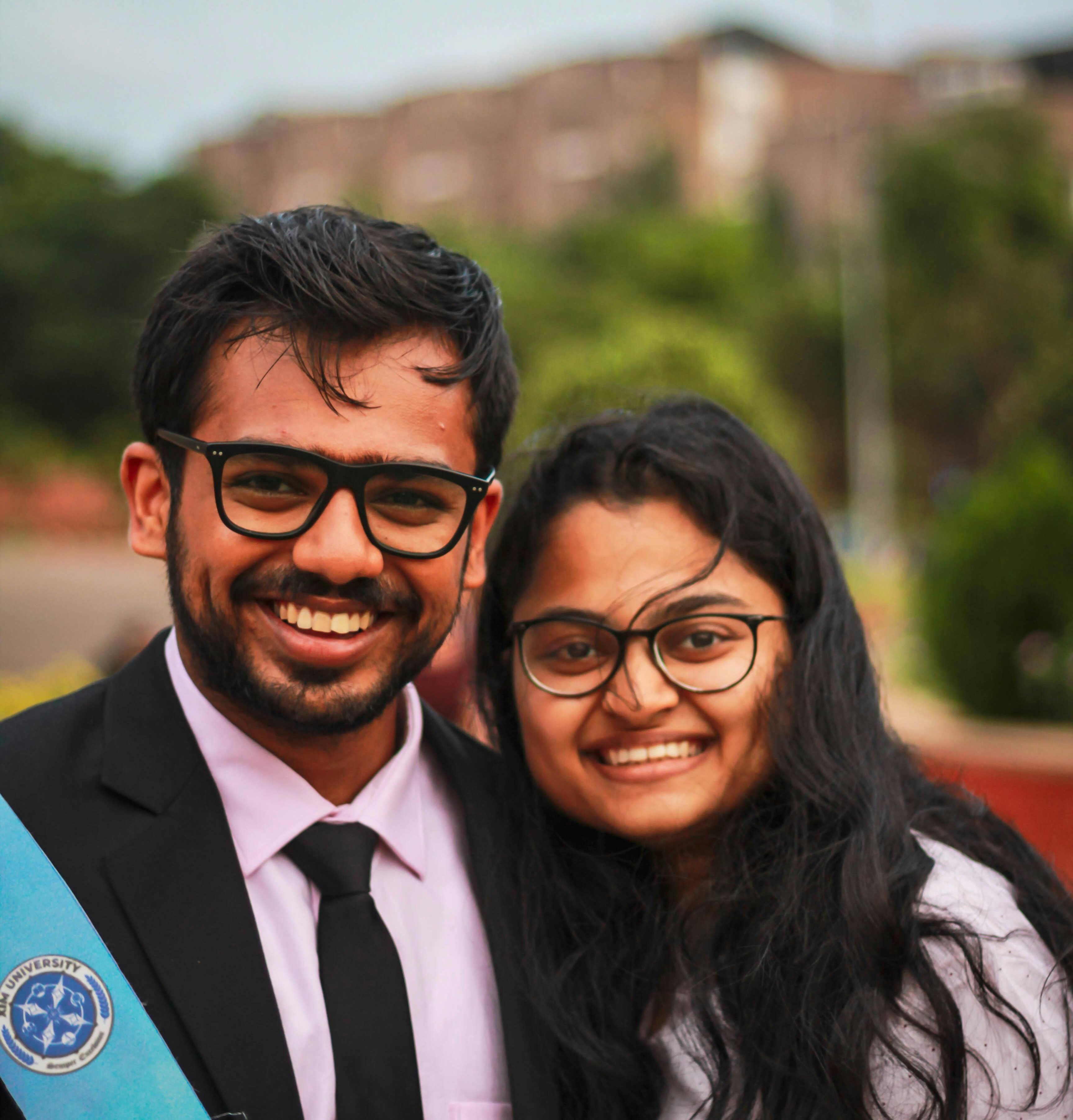 Graduate couple smiling together